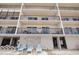 Building with balconies, featuring multiple units and lounge chairs, offering comfortable outdoor living spaces at 14300 Gulf Blvd # 104, Madeira Beach, FL 33708