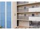 Exterior view of condo building featuring private balconies with black metal railings at 14300 Gulf Blvd # 104, Madeira Beach, FL 33708