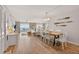 Open concept living space boasts wood floors and an ocean view balcony at 14300 Gulf Blvd # 104, Madeira Beach, FL 33708