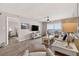 Bright living room with comfortable seating and a flat-screen TV at 14300 Gulf Blvd # 104, Madeira Beach, FL 33708