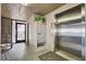 Lobby area with an elevator, mailboxes, and access to an outdoor area at 14300 Gulf Blvd # 104, Madeira Beach, FL 33708