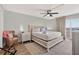 Relaxing main bedroom with balcony access and a calming color scheme at 14300 Gulf Blvd # 104, Madeira Beach, FL 33708