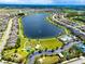 A stunning aerial view of Long Lake Ranch showcasing the lake, community amenities, and surrounding neighborhood at 1601 Fox Grape Loop, Lutz, FL 33558