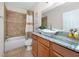 Bathroom features granite countertop vanity, vessel sink, and tile shower with tub at 1601 Fox Grape Loop, Lutz, FL 33558