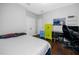 Bedroom with hardwood floors, closet and desk at 1601 Fox Grape Loop, Lutz, FL 33558