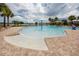 Beautiful zero entry community pool with a water feature and lounge chairs at Long Lake Ranch at 1601 Fox Grape Loop, Lutz, FL 33558