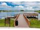 Community dock and lake with sign showing rules at 1601 Fox Grape Loop, Lutz, FL 33558