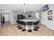 Well-equipped kitchen with a large island, seating, and stainless steel appliances for modern living at 1601 Fox Grape Loop, Lutz, FL 33558