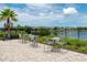 Outdoor patio seating area with tables and chairs overlooking the lake at Long Lake Ranch at 1601 Fox Grape Loop, Lutz, FL 33558