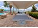 Outdoor ping pong table with sun protection, beautiful stone work, and relaxing view at 1601 Fox Grape Loop, Lutz, FL 33558