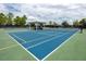 Community tennis court with shelter and benches at 1601 Fox Grape Loop, Lutz, FL 33558