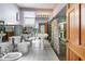 Bathroom has multiple toilets, pedestal sink, and mirrored walls for added space and light at 1701 N Tampania Ave, Tampa, FL 33607