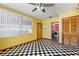 Bright dining room boasts black and white tiled flooring, natural light, and ceiling fan at 1701 N Tampania Ave, Tampa, FL 33607