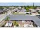 Aerial view of a cozy home featuring a well-maintained roof and a quaint backyard patio at 1701 N Tampania Ave, Tampa, FL 33607
