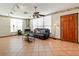 Bright living room featuring a decorative fireplace, tile floors, and abundant natural light at 1701 N Tampania Ave, Tampa, FL 33607