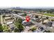 A suburban street featuring multiple homes and a red pin marking the home for sale at 1701 N Tampania Ave, Tampa, FL 33607