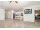 Open-concept living space including kitchen island, neutral color palette, and view to the bedroom at 20828 Cattail Blvd, Venice, FL 34292
