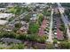 Aerial view of a neighborhood featuring townhomes with community pool and landscaped grounds at 2095 Sunset Point Rd # 2201, Clearwater, FL 33765