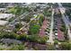 Wide aerial view of a neighborhood with a community pool and tennis courts at 2095 Sunset Point Rd # 2201, Clearwater, FL 33765