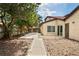 Secluded backyard featuring lush greenery, a spacious patio, and a serene outdoor setting at 2095 Sunset Point Rd # 2201, Clearwater, FL 33765