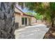 Private backyard featuring a spacious patio area, perfect for outdoor dining and entertaining at 2095 Sunset Point Rd # 2201, Clearwater, FL 33765