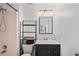 Bathroom with vanity and tub-shower combo, offering a functional and clean space at 2095 Sunset Point Rd # 2201, Clearwater, FL 33765