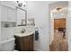 Charming bathroom featuring a vanity with a marble countertop and stylish mosaic tile backsplash at 2095 Sunset Point Rd # 2201, Clearwater, FL 33765