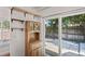 Bright dining area with sliding glass door to the backyard patio and outdoor space at 2095 Sunset Point Rd # 2201, Clearwater, FL 33765