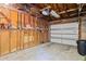 Unfinished garage with bare studs, concrete floor, and white garage door, ready for customization at 2095 Sunset Point Rd # 2201, Clearwater, FL 33765