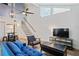 Comfortable living room showcasing high ceilings, a ceiling fan, and an adjacent dining area at 2095 Sunset Point Rd # 2201, Clearwater, FL 33765