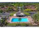 Community pool offers residents a cool retreat surrounded by lounge chairs and manicured landscaping at 2095 Sunset Point Rd # 2201, Clearwater, FL 33765