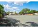Active lifestyle awaits with the community tennis court surrounded by lush landscaping at 2095 Sunset Point Rd # 2201, Clearwater, FL 33765