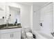 Clean bathroom with granite countertop vanity, a bathtub, and shower combination at 2513 Sunray Venus Way, Ruskin, FL 33570
