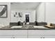 Dual sink vanity features granite countertops, modern fixtures, and ample counter space at 2513 Sunray Venus Way, Ruskin, FL 33570