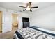 Inviting bedroom featuring comfortable seating visible through an open doorway at 2513 Sunray Venus Way, Ruskin, FL 33570