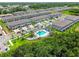 Aerial view of a new community with townhomes and a pool at 2513 Sunray Venus Way, Ruskin, FL 33570