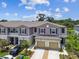 Charming townhome with a two-car garage and a well-manicured front yard at 2513 Sunray Venus Way, Ruskin, FL 33570