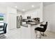 Open concept kitchen featuring stainless steel appliances, granite countertops, and a breakfast bar with seating at 2513 Sunray Venus Way, Ruskin, FL 33570