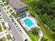 Aerial view of a community pool and surrounding townhomes at 2513 Sunray Venus Way, Ruskin, FL 33570