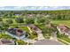 Aerial shot of a lovely home in a neighborhood near a pond and golf course at 26616 Whirlaway Ter, Wesley Chapel, FL 33544