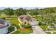 Well-maintained single-Gathering home showcasing lush landscaping and a spacious two-car garage at 26616 Whirlaway Ter, Wesley Chapel, FL 33544
