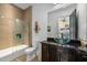 Stylish bathroom with modern glass shower, vessel sink, and chic fixtures, offering a spa-like experience at 2711 W Trilby Ave, Tampa, FL 33611