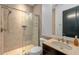 Modern bathroom features glass enclosed shower, neutral tile, and stylish vanity at 2711 W Trilby Ave, Tampa, FL 33611