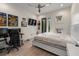 Bright bedroom with white walls, neutral floors, modern fixtures, and private balcony access at 2711 W Trilby Ave, Tampa, FL 33611