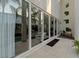 Modern home exterior with large sliding glass doors that allow natural light to flow into the home at 2711 W Trilby Ave, Tampa, FL 33611
