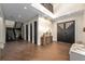 Open foyer featuring hardwood floors and a modern staircase at 2711 W Trilby Ave, Tampa, FL 33611