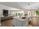 Bright kitchen with a large island, white cabinets, stainless steel appliances, and an open layout at 2711 W Trilby Ave, Tampa, FL 33611
