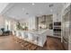 Bright, modern kitchen with a large island, marble countertops, stainless steel appliances, and stylish seating at 2711 W Trilby Ave, Tampa, FL 33611