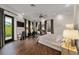 Spacious main bedroom features a private balcony, exercise equipment, and ample natural light at 2711 W Trilby Ave, Tampa, FL 33611