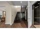 Modern staircase with wood steps and metal railings, open to an elevator at 2711 W Trilby Ave, Tampa, FL 33611